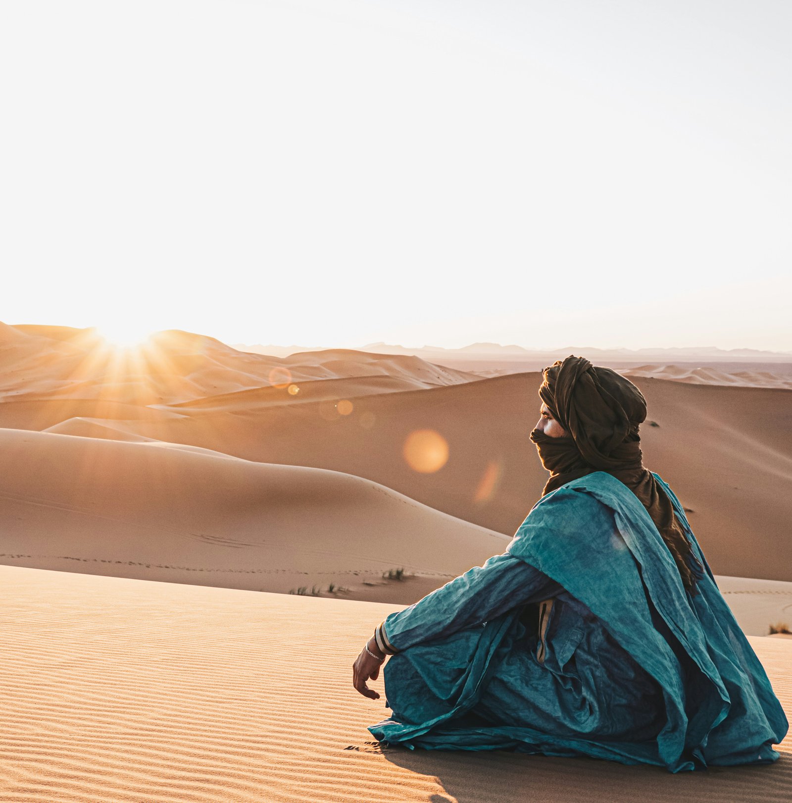 Sahara desert tour tips — camel trek at sunset in Erg Chebbi dunes, Merzouga Morocco